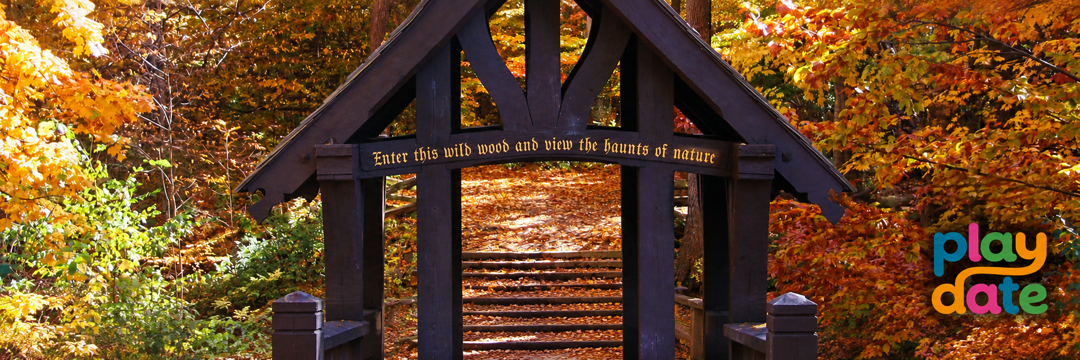 The famous covered Seven Bridges entrance surrounded by fall leaves, with the Play Date logo overlay.